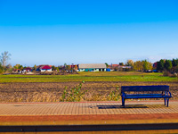 Bench and landscape at Tiszatenyő station