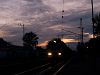 A V43 is passing through Balatonfenyves station by sunset