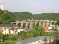 A DoSto passanger train on Pfaffenthal viaduct in Luxembourg