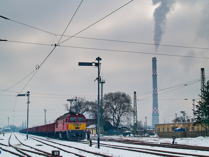 The MÁV-TR M62 230 seen with a train carrying road salt at Óbuda photo