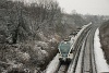 The 415 094 is waiting at Pestszentlőrinc entry signal in a freshly started snowfall