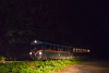 Toby, the wood covered box-like little railcar near Hártókút at night