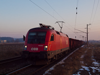The ÖBB 1116 013 seen hauling an empty coal train near Dunaújváros külső
