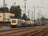 The 1047 005-2 is seen hauling a freight train through  Nyékládháza