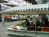 They are selling fruites nder the station roof