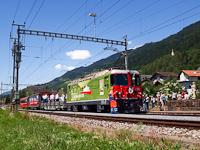 The Ge 4/4<sup>II</sup> 630 <q>100 years Chur-Disentis</q> is pulling the moving stage special train on the celebrations of the anniversary of the railway at Trun station