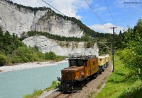 The RhB Ge 6/6<sup>I</sup> 415 is pulling a historic Classic Pullman train through the Rhein gorge between Trin and Versam-Safien