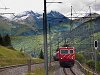 The Matterhorn-Gotthardbahn's HGe 4/4<sup>II</sup> 104 rack-and-pinion electric locomotive is pulling a freight train near Tscheppa junction on the Oberalppass-line