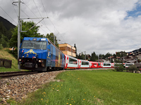 The RhB Ge 4/4<sup>III</sup> 652 <q>Hockey Club Davos</q> is pulling the Glacier-Express panoramic train between Sumvitg-Cumpadials and Disentis/Mustér