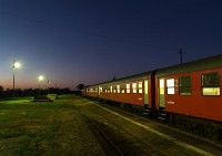 An MDmot DMU at sunset at Nagykereki station