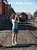 A girl taking photos of the locomotives at the Hatvan depot