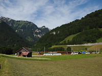 The MOB Ge 4/4 8001 <q>Menuhin Festival Gstaadt</q> seen between La Tine and Rossiniere hauling the Crystal Panoramic Express