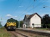 The GYSEV M44 307 is seen at Boldogasszony station (Frauenkirchen, Austria) - the MÁV-HÉV class 1 building had been expanded with a small outlook office for the dispatcher which has since been removed due to the building of a new track and platform