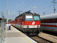 The BB 1144 279-5 seen hauling four Jaffa-livery Schlierenwagen at St. Plten Hauptbahnhof