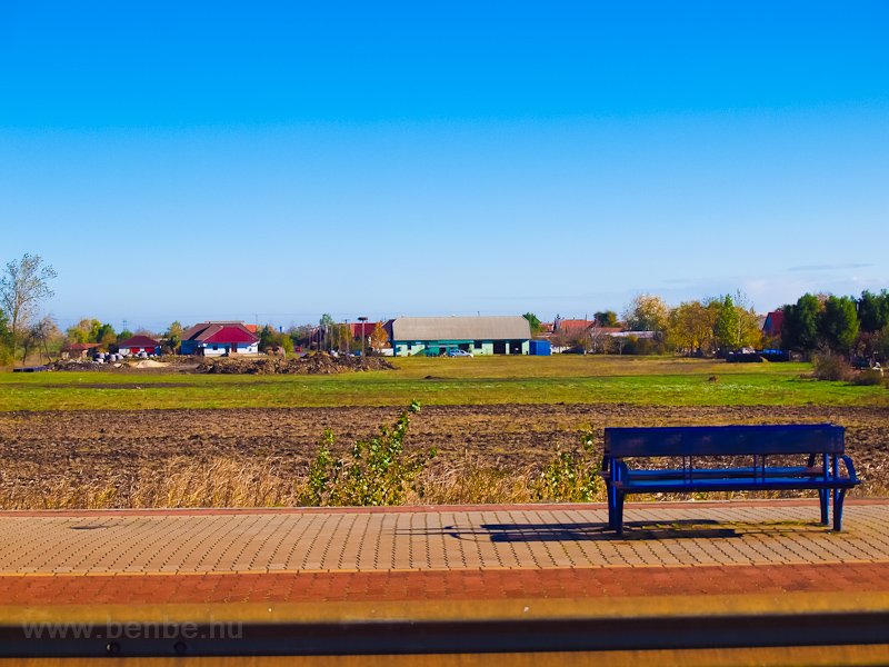 Bench and landscape at Tiszatenyő station photo