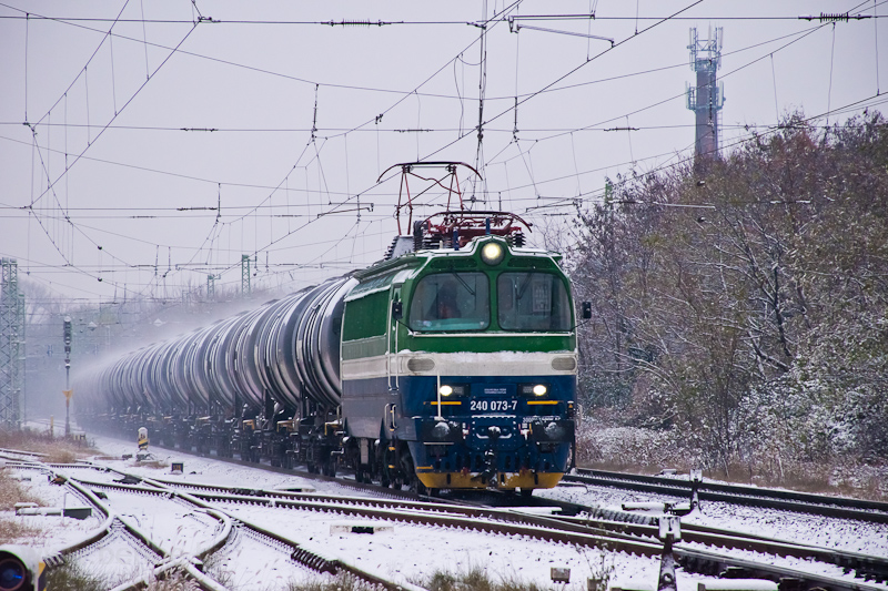 The ZOS (Železničn opravovne a strojrne Zvolen) 240 073-7 "Laminatka" seen between Kőbnya-Kispest and Pestszentlőrinc hauling a tank car freight train photo