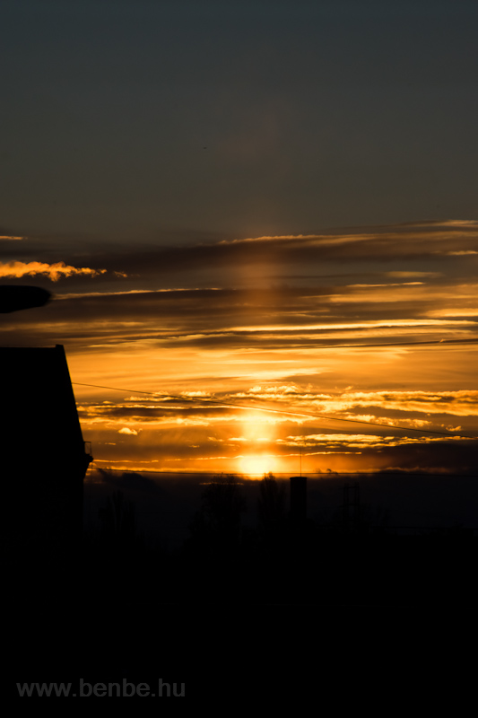 Solar light pillar at Kőbnya als, Budapest, Hungary around sunset photo