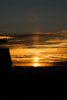 Solar light pillar at Kőbnya als, Budapest, Hungary around sunset