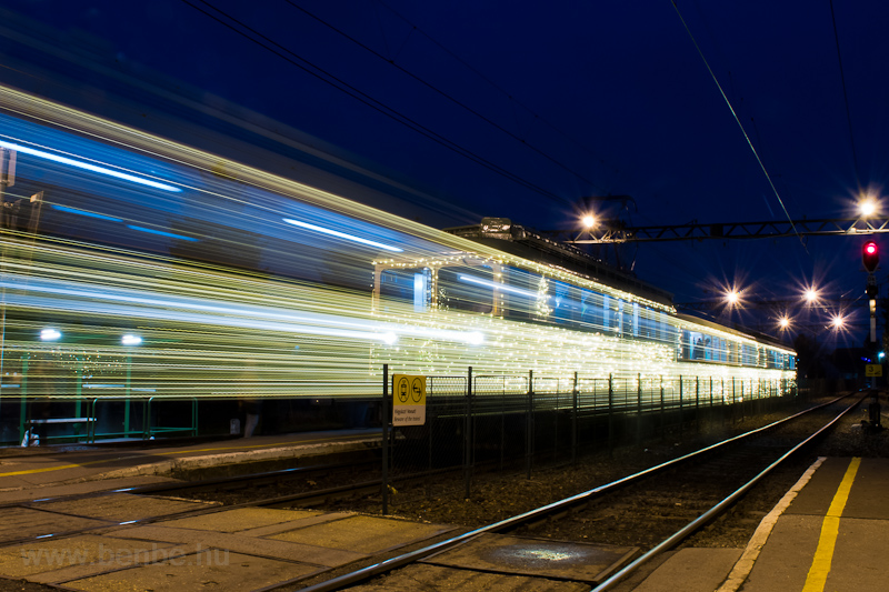 The MV-HV LVII. 83 seen at Budakalsz as illuminated Christmas suburban train at the blue hour photo