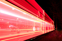 Red illuminated Tatra tram arrives at Kposztsmegyer