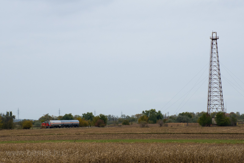 The MV-START 478 239 seen hauling a freight train between Borsihalom and Kismindszenti t next to the oil drilling tower photo