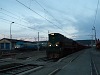 The ŠZ 664-114 is hauling a freight train through Divača from Sežana (Triest) while an Adria Herkules is pulling in another freight from Koper