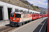 The RhB Ge 4/4<sup>II</sup> 622 in the advertising livery of the Hakone-Tozan Railway is seen hauling a Scuol-Tarasp to Disentis/Mustr RegioExpress at Sagliains station