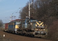 The V46 034 helping pull up the first Hungarian-built V43 its heavy freight train between Városlõd and Szentgál