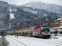 The ÖBB 1116 246-8 <q>50 Jahre Bundesheer</q>-Taurus with a silo wagon freight train at Mürzzuschlag station