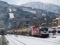 The BB 1116 246-8 <q>50 Jahre Bundesheer</q>-Taurus with a silo wagon freight train at Mrzzuschlag station