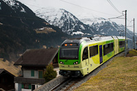 The TPC Beh 2/6 546 seen between Val-d'Illiez and Fayot with snow-covered mountains in the background