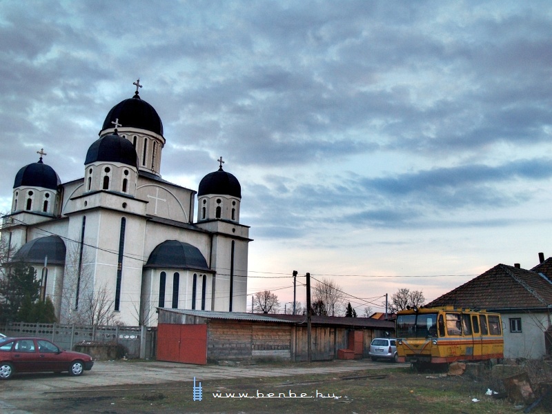 A maintenance railcar and a church at Szatmrnmeti (Satu Mare) photo