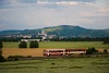 The ŽSSK 812 050-7 seen between Strovo and Kamenny Most nad Hronom with the Basilica of Esztergom in the background