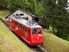 The Pilatusbahn (PB) Bhe 1/2 23 seen between Aemsigen and Alpnachstad