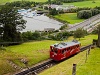 The Pilatusbahn (PB) Bhe 1/2 27 seen between Alpnachstad and Aemsigen