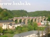 A DoSto passanger train on Pfaffenthal viaduct in Luxembourg
