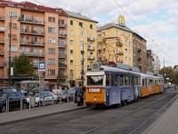 A three-car UV tram on line 49 in advertisement livery