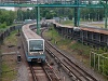 A dark blue (line three) 81-740 train is arriving at Kuntsevskaya (Кунцевская)