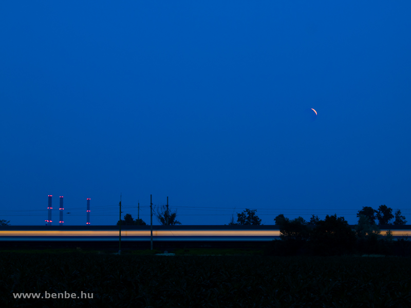 A fast train under the lunar eclipse photo