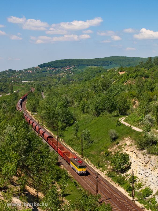 The GYSEV !3 328 is hauling a freight train uphill near Alsgalla photo