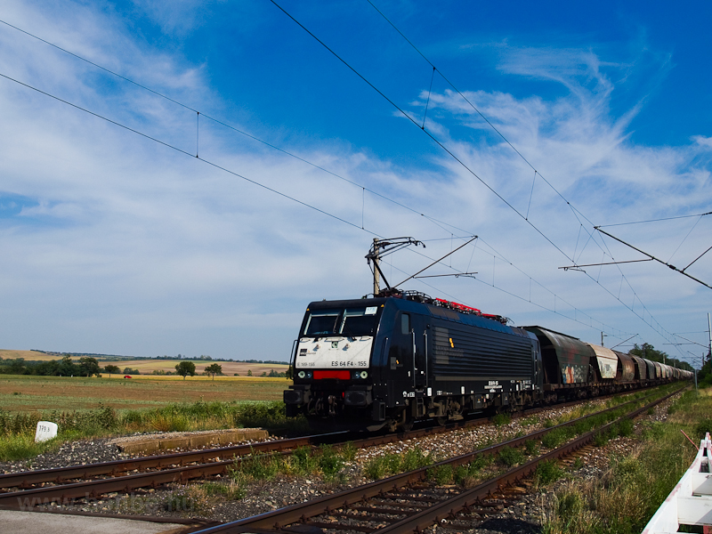 The MRCE Dispolok ES 64 F4 - 155 is seen hauling a freight train between Muzsla and Kblkt photo