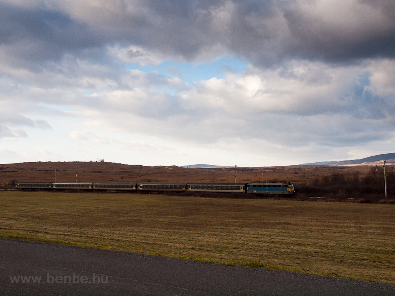 A fast train seen between H photo