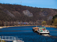Barge on the Vltava with a ČD CityElefant in the background, seen between Úholičky and Roztoky-Žálov