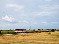 The ŽSSK Cargo 751 055-5 is seen hauling a local freight between Diósförgepatony (Orechová Potoň, Slovakia) and Szentmihályfa (Michal na Ostrove, Slovakia)