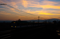 A BKV suburban train in the snset near Pannniatelep