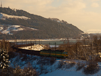 A freight train hauled by a ŽSSKC class 131 electric locomotive seen near the reservoir Liptovsk Mara between Liptovsk Tepl and Liptovsk Vlachy