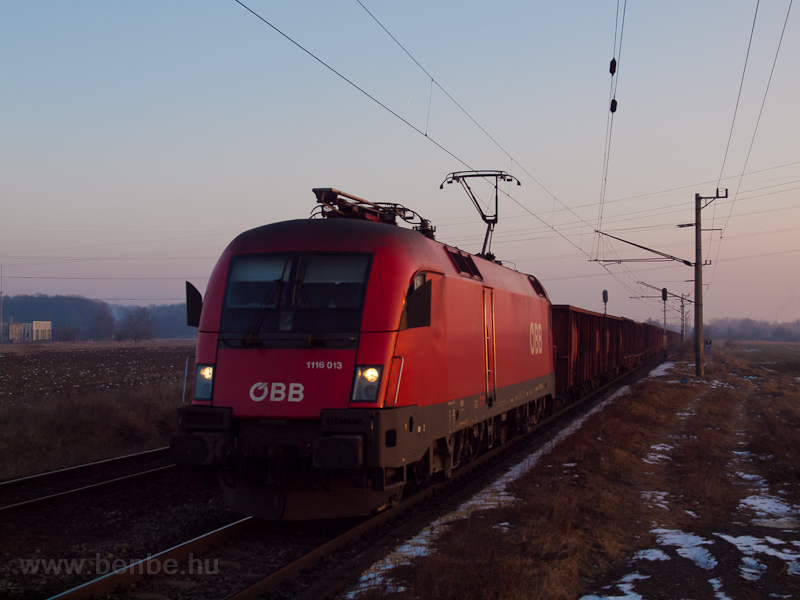 The BB 1116 013 seen hauling an empty coal train near Dunajvros klső photo