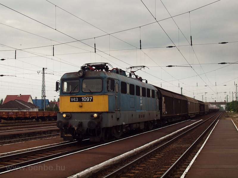 The V43 1097 is seen hauling a freight train through Nykldhza photo