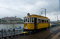 The BKV woodframe historic tram number 2806 at Vigad tr, with the Buda Castle in the background