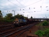 The V46 018 is pulling a train of wheat carriers to Ferencváros marshalling station